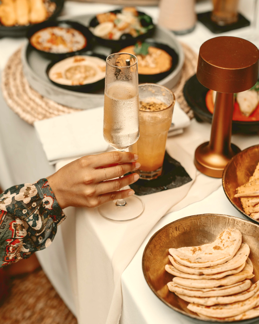 A table of mezze and drinks laid out for guests